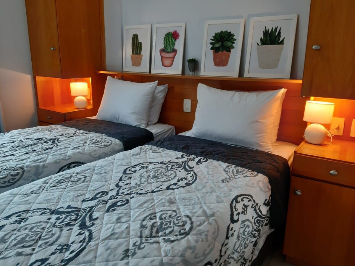 quarto do airbnb Flat a 150 metros da praia