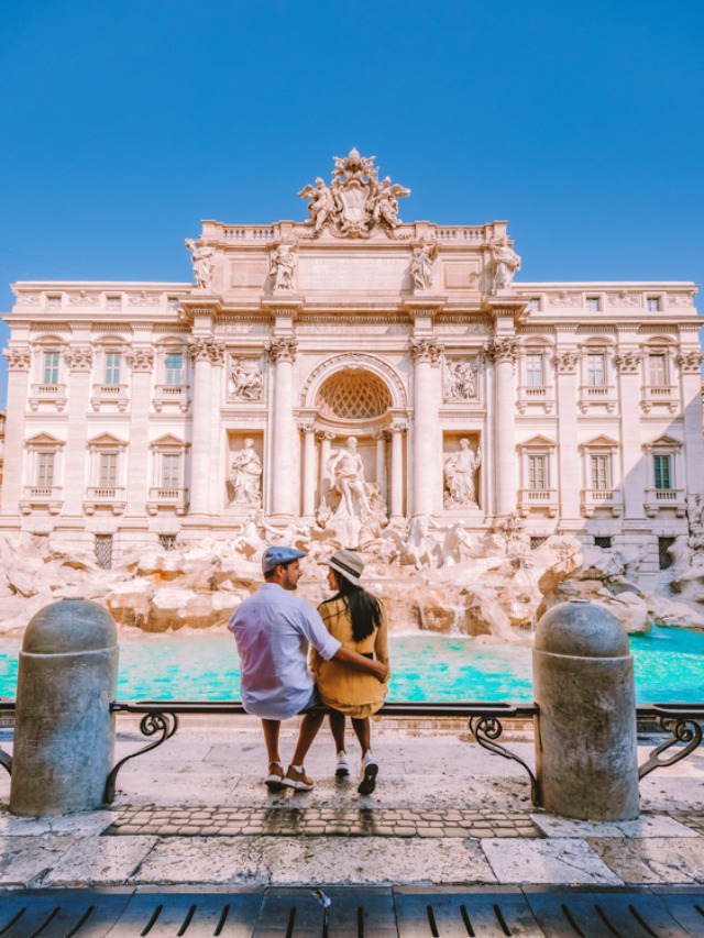 young couple mid age on a city trip in Rome Italy